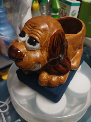 Ceramic planter in the form of a puppy dog with exaggerated features