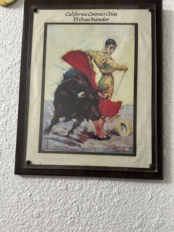 Framed vintage poster titled 'California Contract Cities El Gran Matador' featuring bullfighter Joaquin Bernado