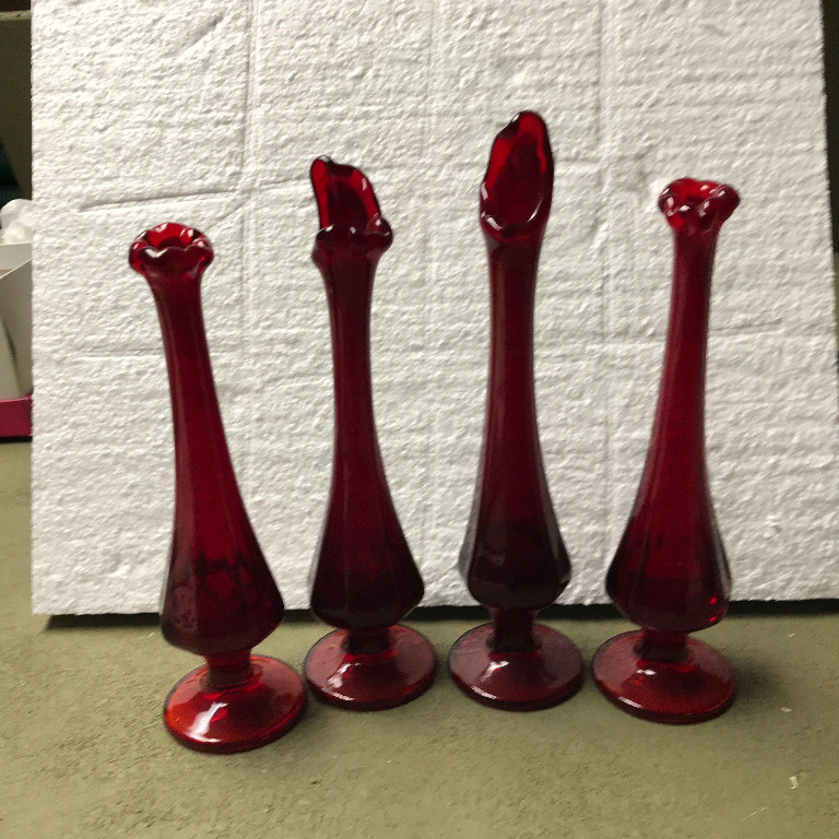 Set of four ruby red glass swung vases