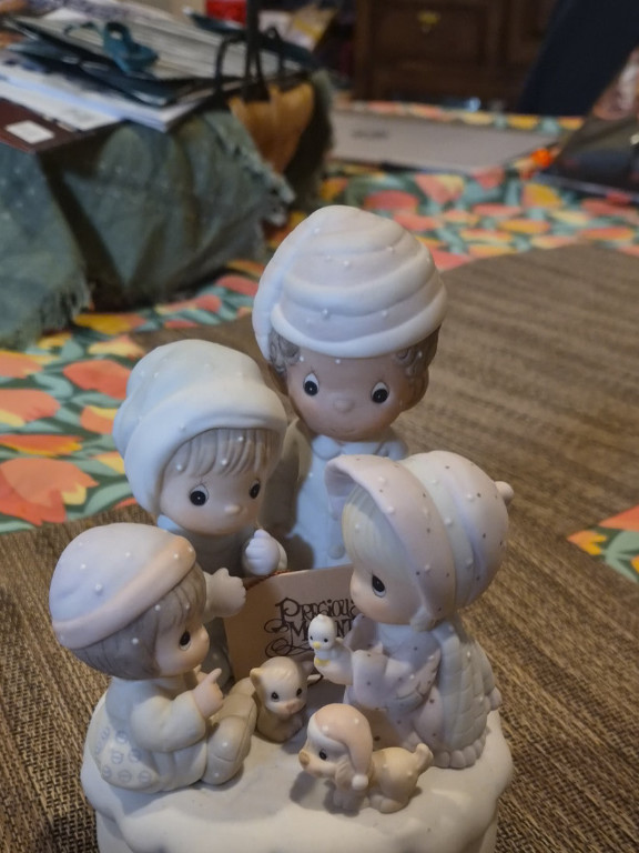 Porcelain figurine titled 'Peace on Earth' by Precious Moments