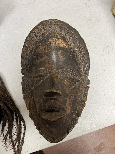 Wooden African tribal mask, likely Guro or Baule style from Ivory Coast