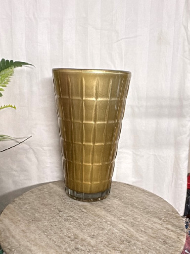 Brass embossed tumbler glass with geometric grid pattern