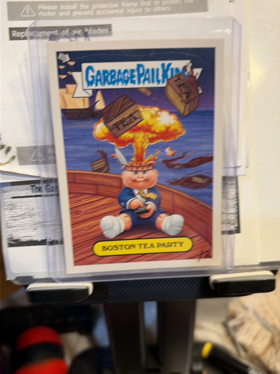Trading card from Garbage Pail Kids 'Brand New Series 1' titled 'Boston Tea Party' featuring Adam Bomb character, produced by Topps