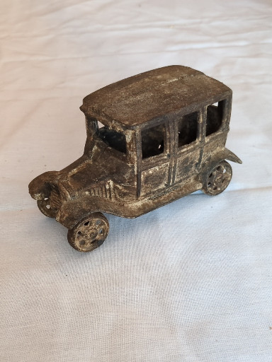 Cast iron toy automobile depicting a Ford Model T sedan