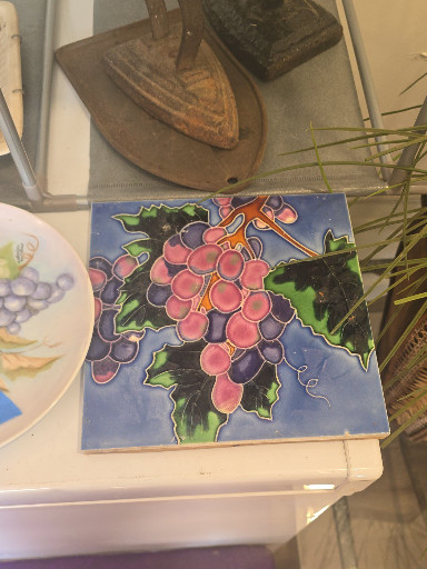 Ceramic decorative tile with hand-painted grape cluster design
