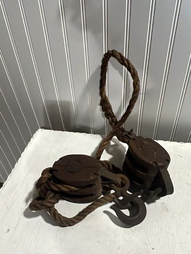 Vintage cast iron double block and tackle pulley with rope
