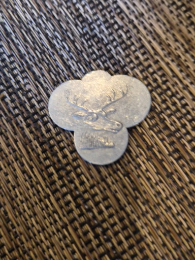 Aluminum fraternal token featuring an elk or moose emblem, likely from the Benevolent and Protective Order of Elks (B.P.O.E.)