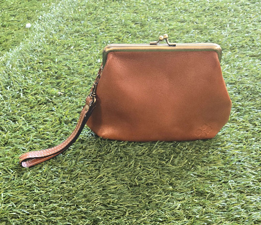 Leather kiss-lock wristlet clutch by Patricia Nash