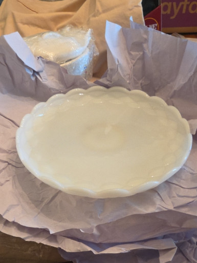 Milk glass pedestal cake plate with scalloped edge