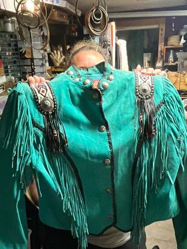 Turquoise suede Western-style jacket with fringe and concho embellishments