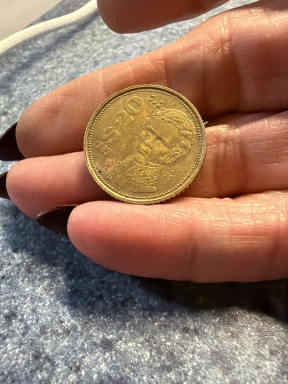 Mexican brass 20 Pesos coin featuring Guadalupe Victoria