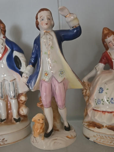 Porcelain figurine of a Victorian gentleman with dog, made in Occupied Japan