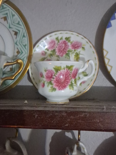 Bone china teacup and saucer set titled 'Flower of the Month - November (Chrysanthemum)' by Royal Albert