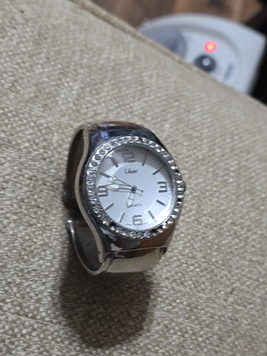 Fashion cuff watch with rhinestone-embellished bezel and white dial