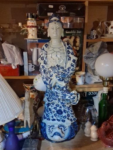 Blue and white porcelain figure of Guanyin (Kwan Yin) seated on a qilin