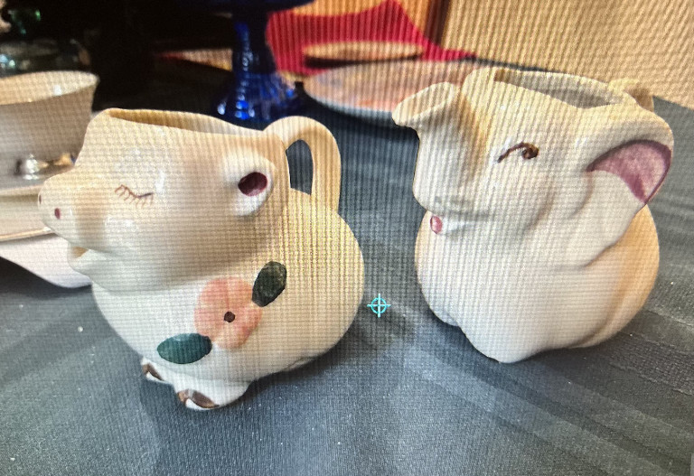 Ceramic Smiley Pig creamers by Shawnee Pottery