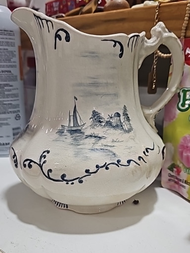 Ceramic pitcher with Dresden hallmark, dated 1897, featuring Delft-style windmill and sailboat decoration