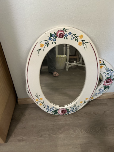 Hand-painted ceramic oval wall mirror with floral decoration