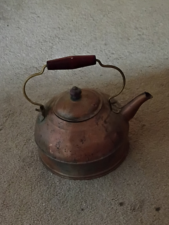 Copper tea kettle with wooden handle