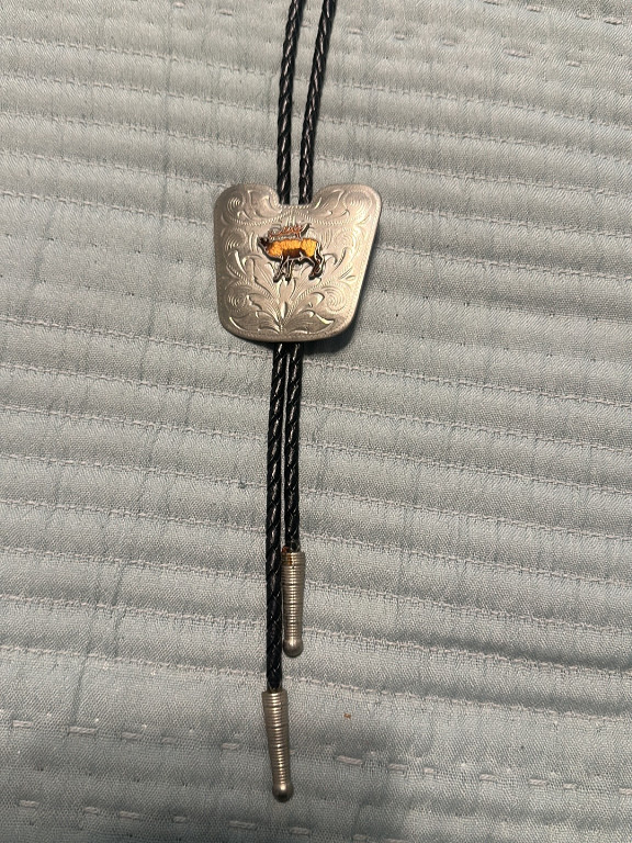 Sterling silver bolo tie with inlaid thunderbird design