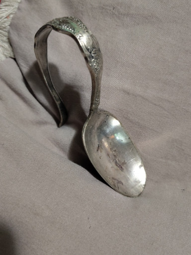 Silverplate baby spoon with curved handle in 'La Vigne' pattern by 1847 Rogers Bros.