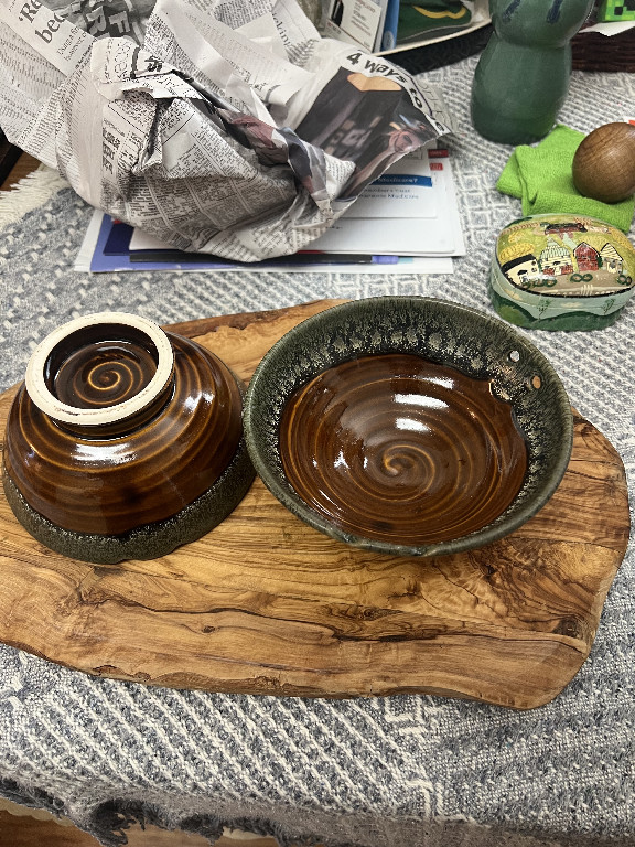 Handmade stoneware noodle bowl set with brown spiral glaze and integrated chopstick rest, signed 'YY'