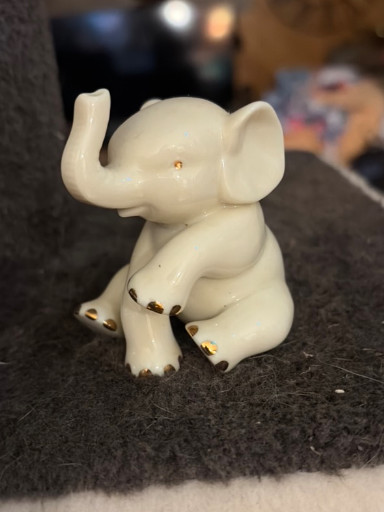 Ivory porcelain sitting baby elephant figurine with 24K gold trim by Lenox