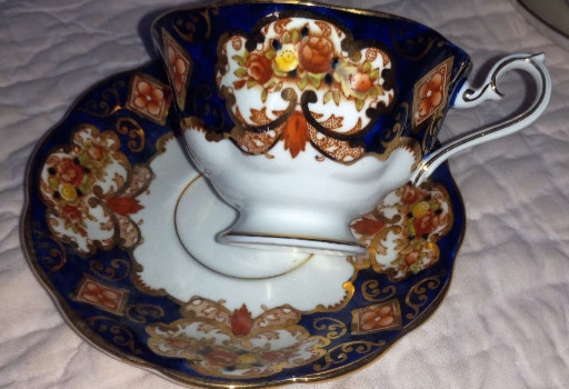 Bone china tea cup and saucer set in 'Heirloom' pattern by Royal Albert