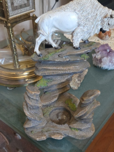 Polyresin tabletop fountain with faux stacked stone design and white buffalo figurine
