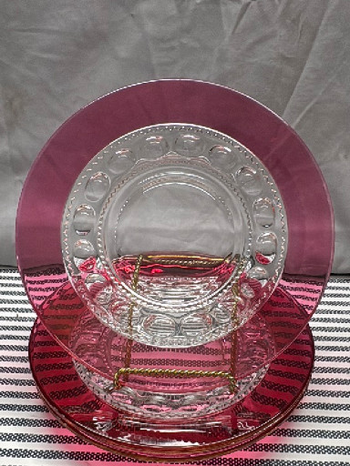 Glass luncheon plates with ruby red flashed 'Kings Crown Thumbprint' pattern by Indiana Glass Company
