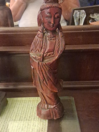 Hand-carved wooden sculpture of Guanyin (Kwan Yin), Chinese Buddhist Goddess of Mercy
