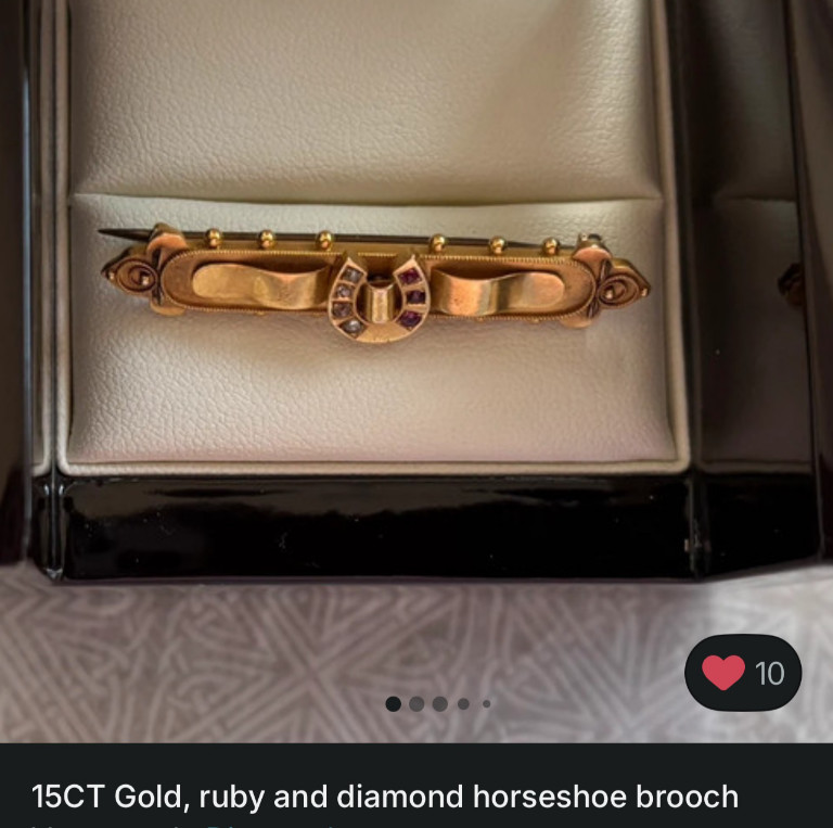 15ct gold bar brooch with ruby and diamond horseshoe motif