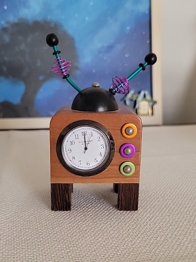 Handmade wooden retro robot clock with colorful buttons and antenna