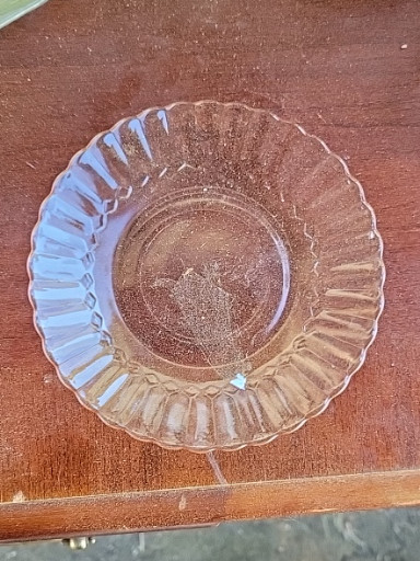 Clear glass saucer with scalloped edges, likely by Fortecrisa or similar manufacturer