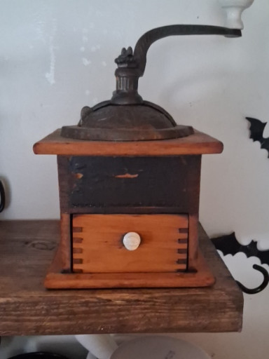 Vintage wooden coffee grinder with cast iron mechanism