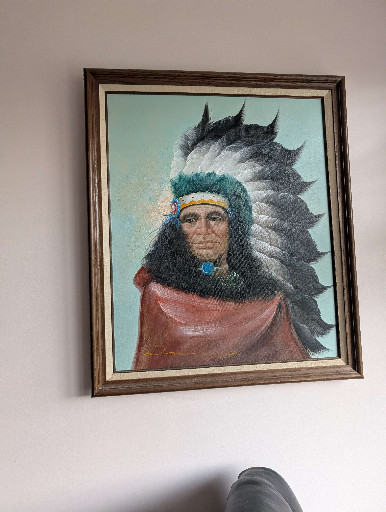 Oil painting depicting a Native American Chief in traditional headdress, signed 'Bette'