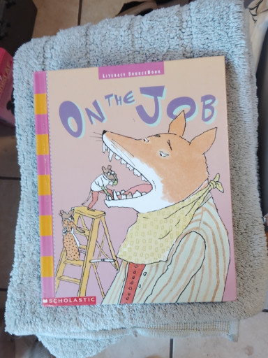 Children's educational book titled 'On The Job' from Scholastic Literacy Place series