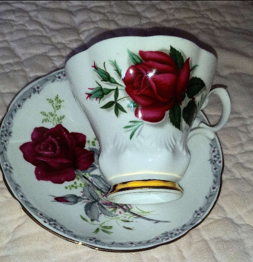 Fine bone china teacup and saucer set titled 'Roses to Remember' by Royal Stafford