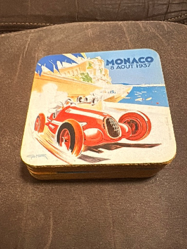 Decorative tin box featuring reproduction of 1937 Monaco Grand Prix poster by Geo Ham