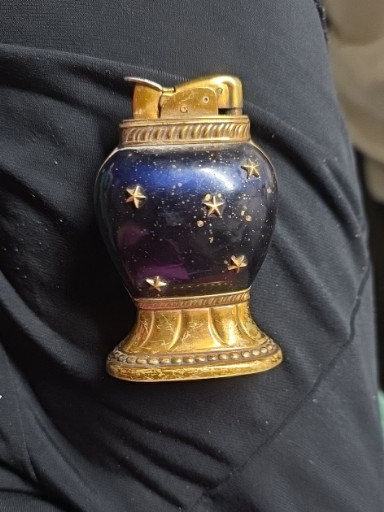 Evans brass and cobalt blue glass table lighter with gold star decoration