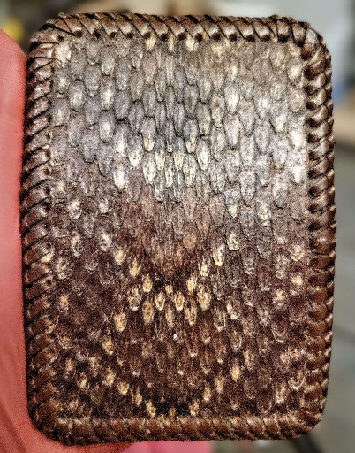 Vintage handcrafted snakeskin belt buckle cover with whipstitch edging