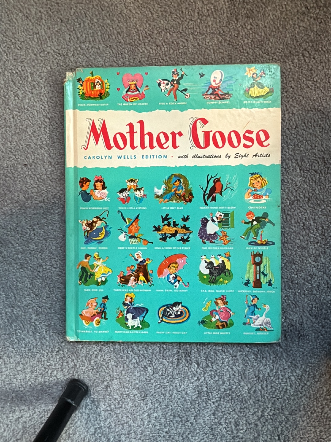 Hardcover book titled 'Mother Goose' Carolyn Wells Edition with illustrations by Eight Artists