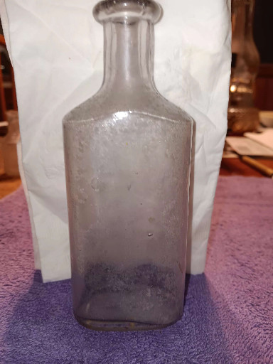 Clear glass rectangular medicine bottle