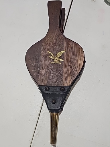Vintage fireplace bellows with wood body, leather sides, and brass eagle emblem