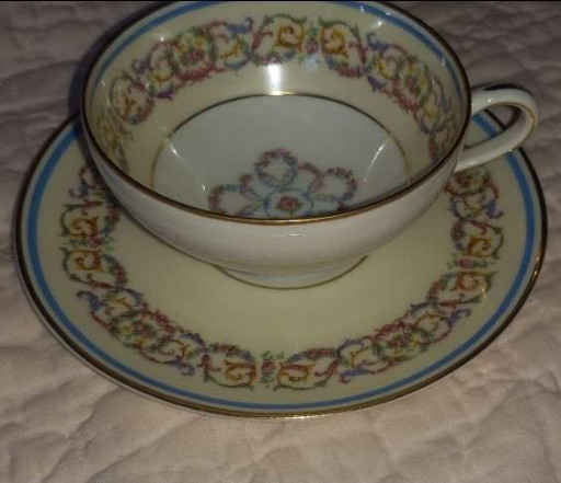 Porcelain teacup and saucer in the 'Chamonix' pattern by Charles Ahrenfeldt Limoges