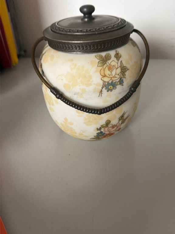 Victorian-era opaline glass biscuit jar with hand-painted floral decoration and silver-plated lid and handle
