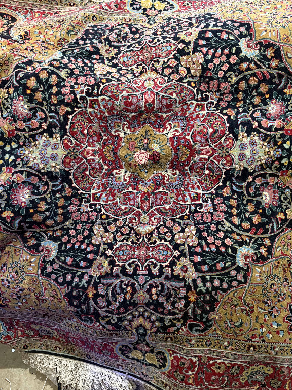 Handmade Persian silk and wool carpet with floral medallion design