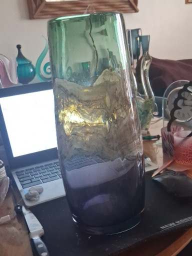 Art glass vase with blue-green gradient and abstract metallic inclusions