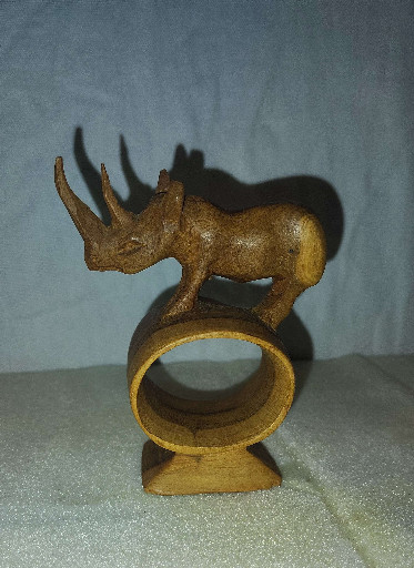 Hand-carved wooden napkin ring featuring a rhinoceros, made in Kenya