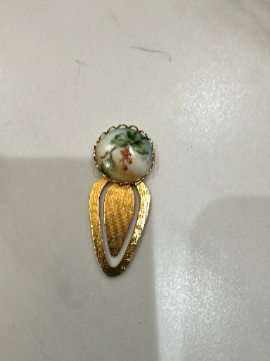 Gold-tone metal bookmark with hand-painted porcelain floral cameo